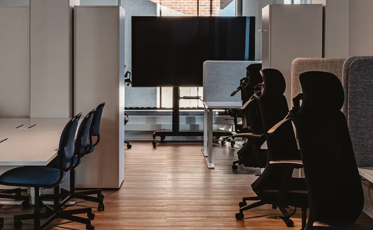 Coworking desks with acoustic dividers at M8S Hub, Kalasatama