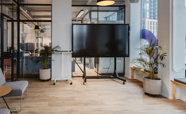 Presentation area with a large display at the M8S event venue